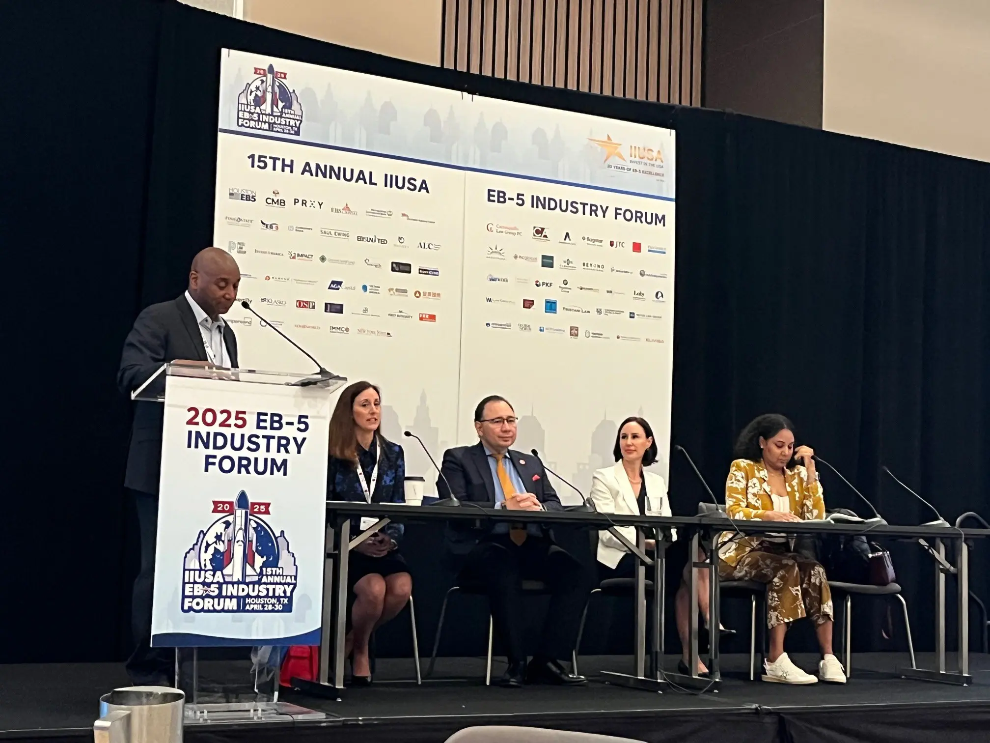 Jennifer Smith sitting on a panel discussion at 2025 IIUSA EB-5 Industry Forum